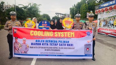 Satlantas Polresta Pekanbaru Gelar Pengamanan CFD dan Sosialisasi Pilkada Damai 2024